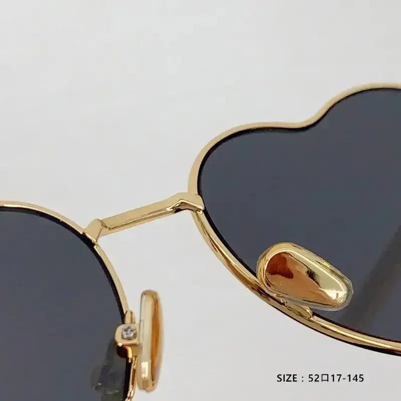 Heart Luv Sunglasses with gold frames in ultimate blend style, perfect for summer vibes