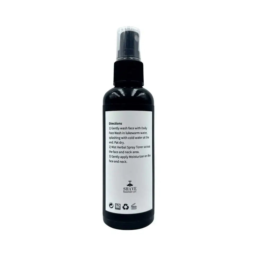 Black spray bottle for Herbal Spray Toner with clear directions on the label