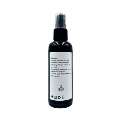 Black spray bottle for Herbal Spray Toner with clear directions on the label