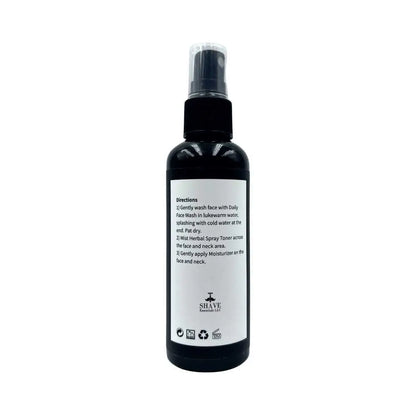 Black spray bottle with instructions for Herbal Spray Toner in a sleek design