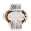 Woven basket with owl-themed dish and patterned towel.