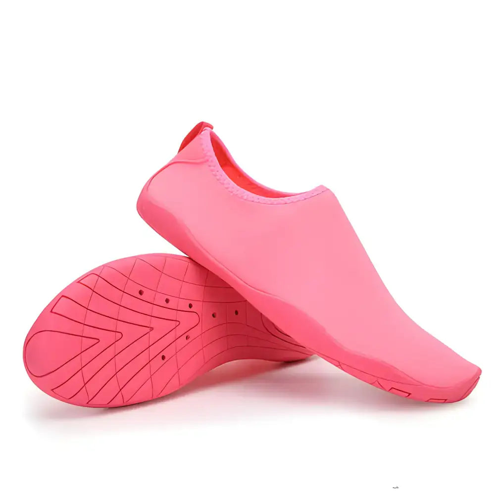 Pair of pink water shoes from Hot Shoe Deals for trendy women this summer