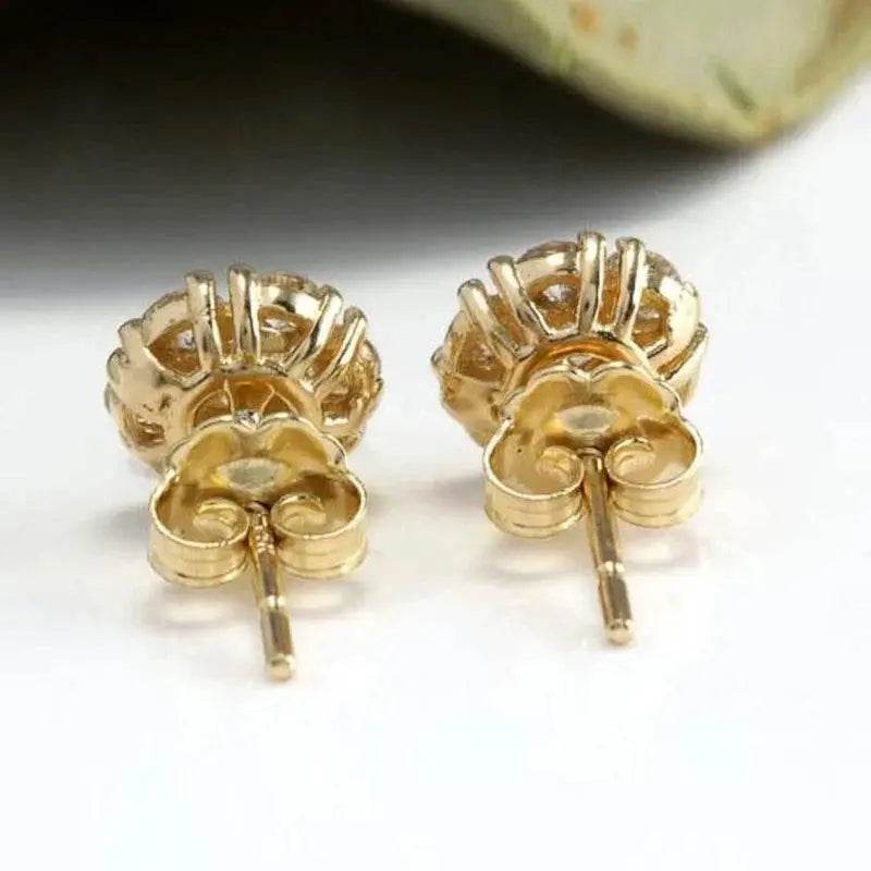 Gold stud earrings.