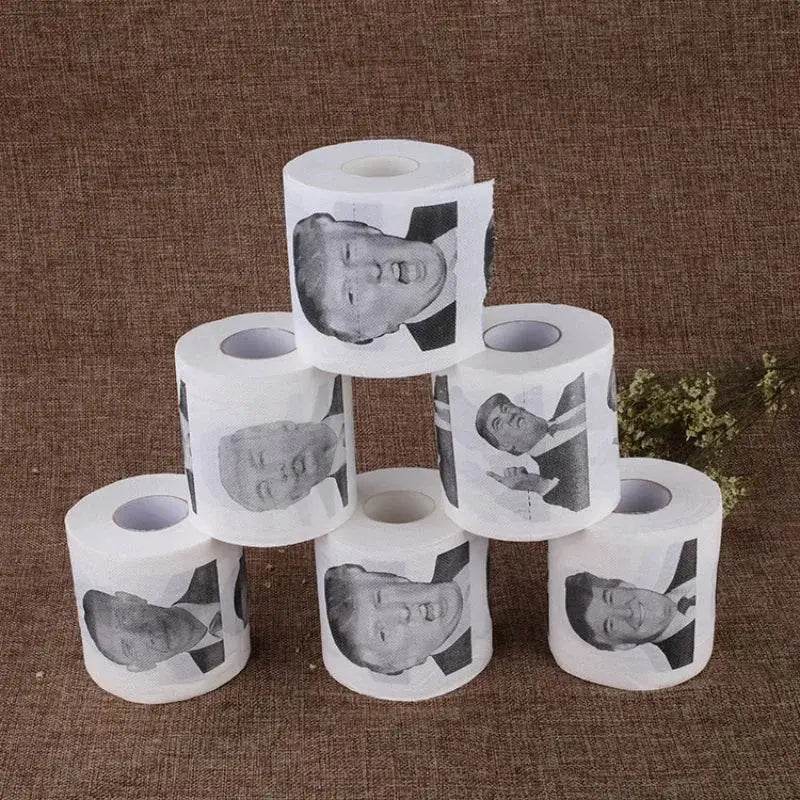 Toilet paper rolls with a person’s face printed on them.