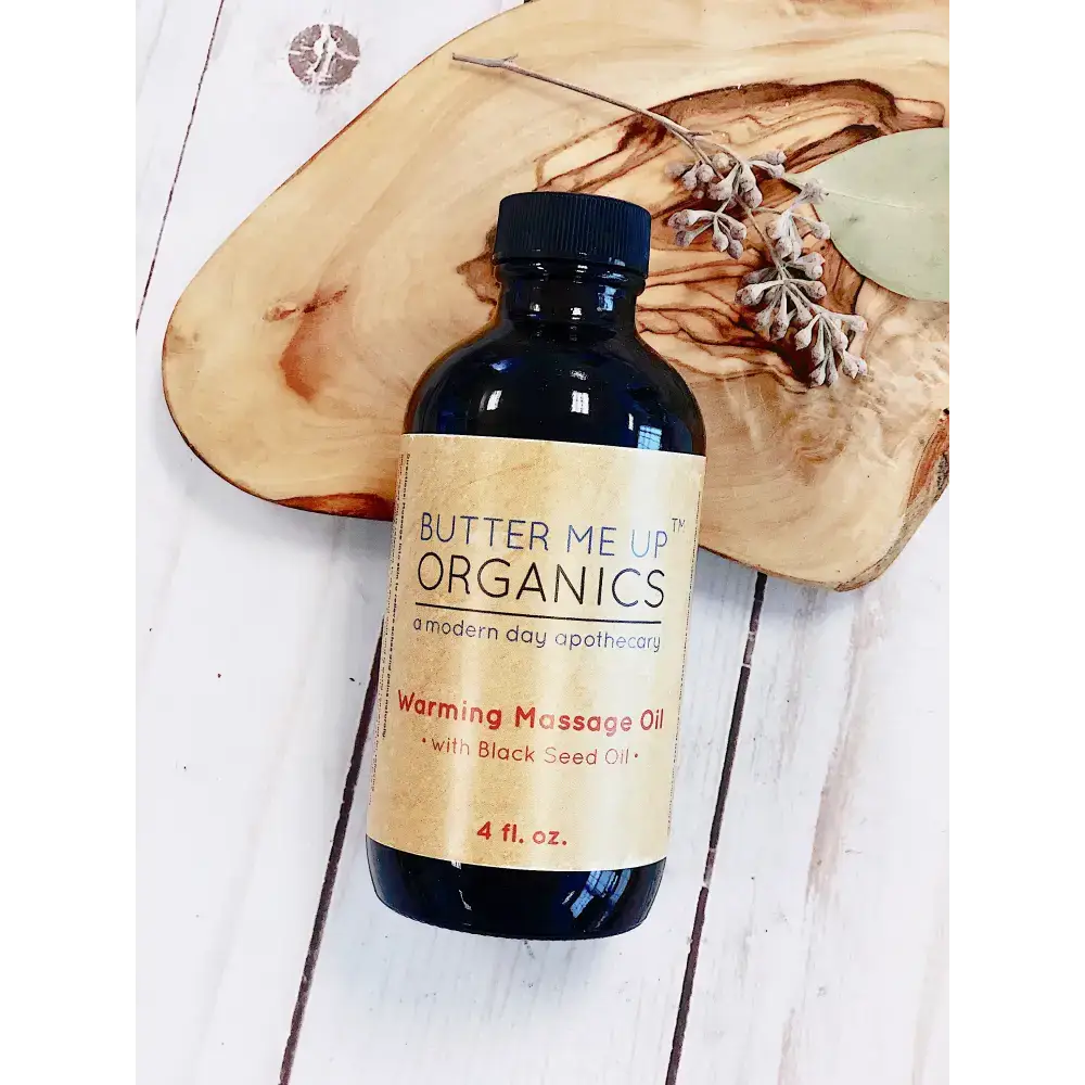 Bottle of Ignite Your Muscles organic warming massage oil for muscle ache relief