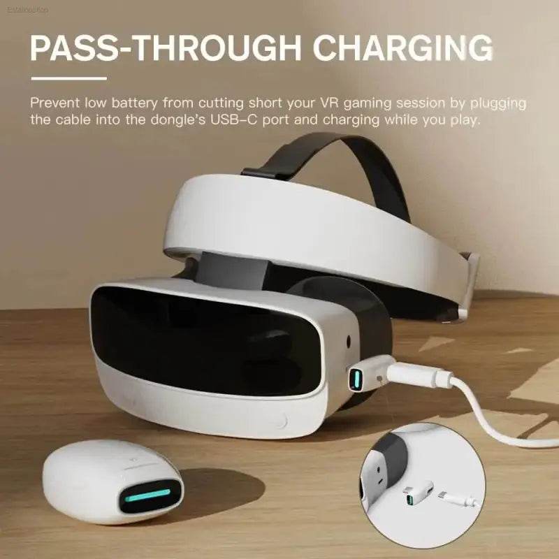 White VR headset with charging cable.