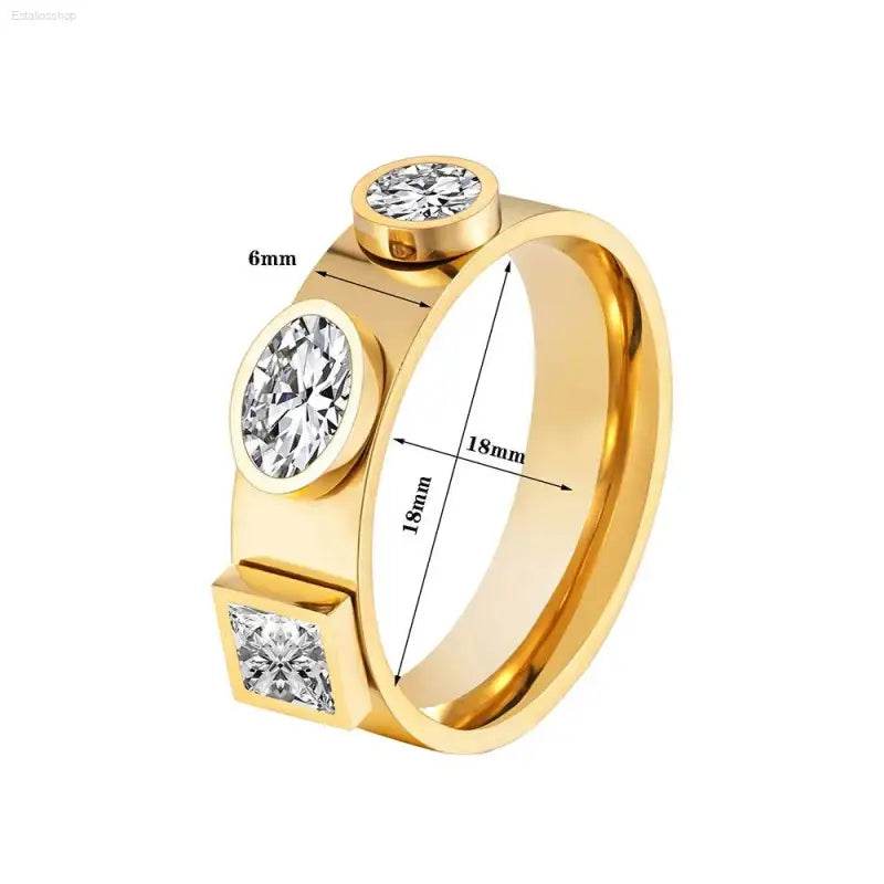 Gold ring with three embedded gemstones.