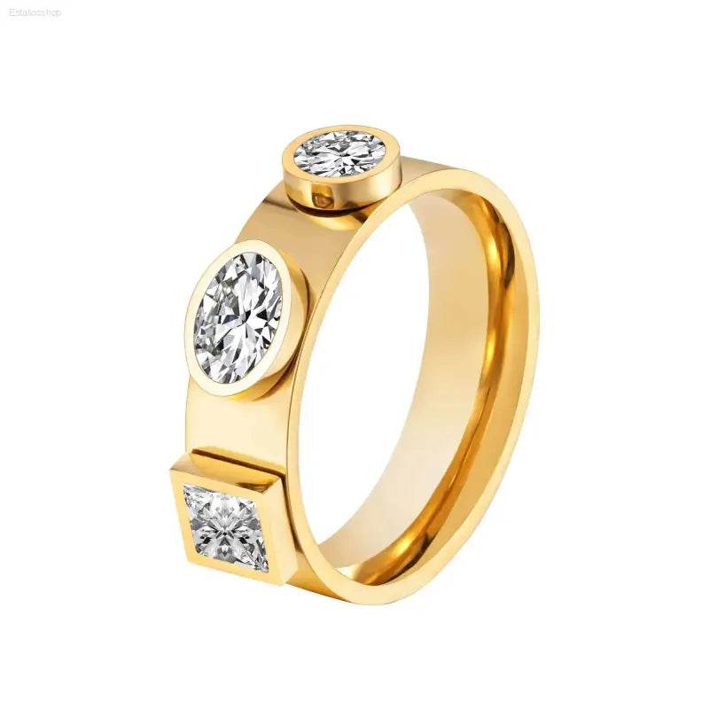 Gold ring with three geometric-shaped diamonds.