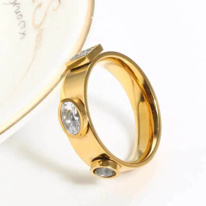 Gold ring with embedded stones.