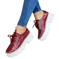 Strut in Style: Burgundy & Black Patent Leather Platforms for Comfort - Estalios