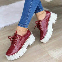 Strut in Style: Burgundy & Black Patent Leather Platforms for Comfort - Estalios