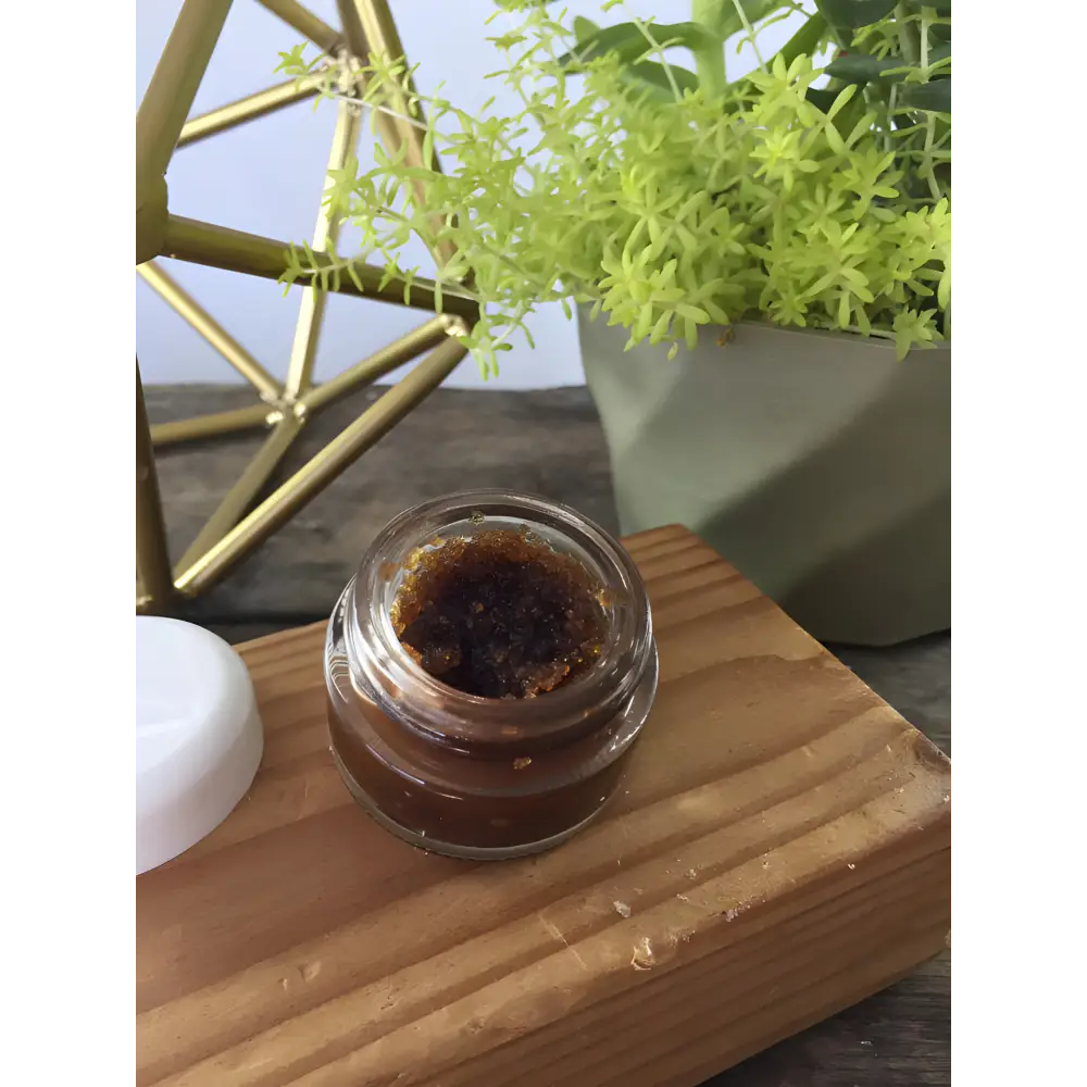 Open jar of Kiss Flaky Lips Goodbye Organic Chocolate Lip Scrub for flaky chapped lips