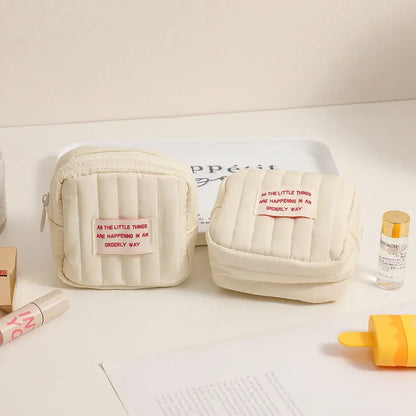 Two quilted cream cosmetic bags from the Korean Square Small Makeup Bag Duo