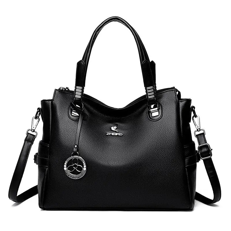 Black leather handbag with shoulder strap perfect for a stylish gift handbag card