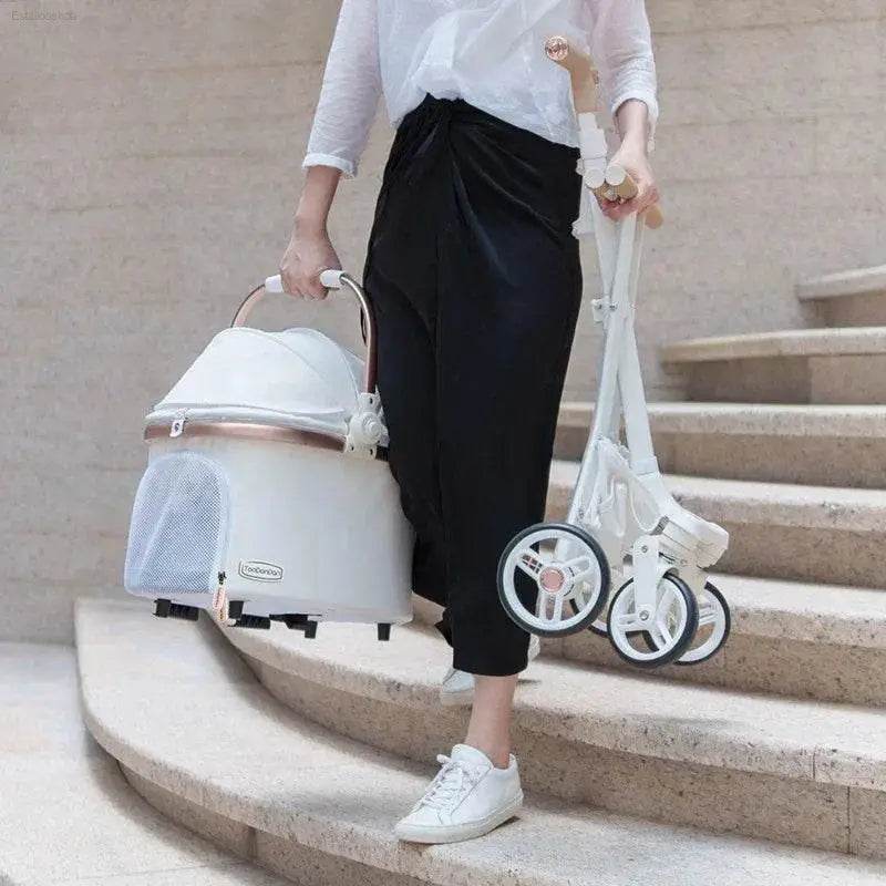 Folded white baby stroller.