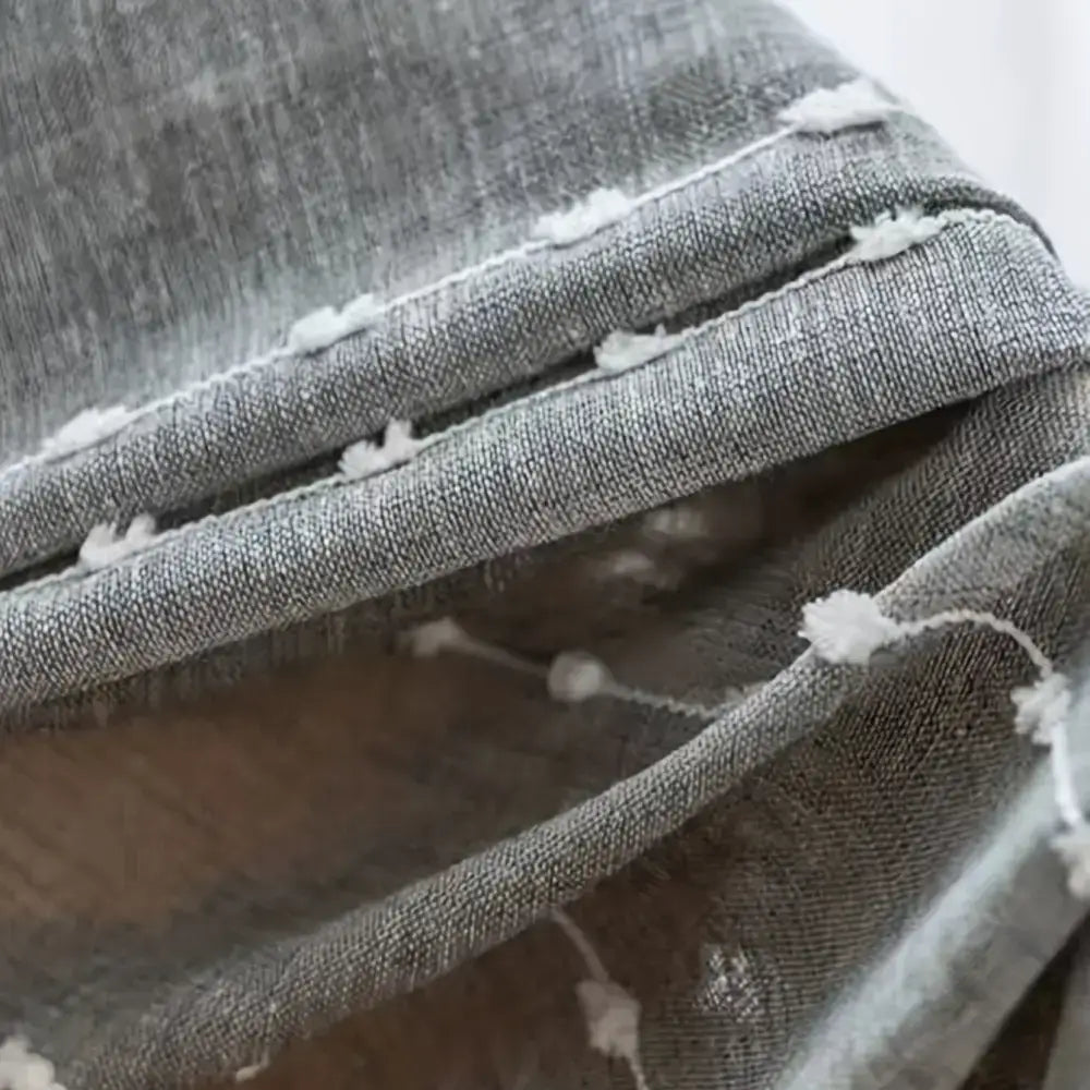 Gray fabric Linen Sheer Curtain with fun white pom-poms and an elegant embroidered ball design