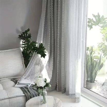 Light gray linen sheer curtains with dotted lines for an elegant embroidered ball look