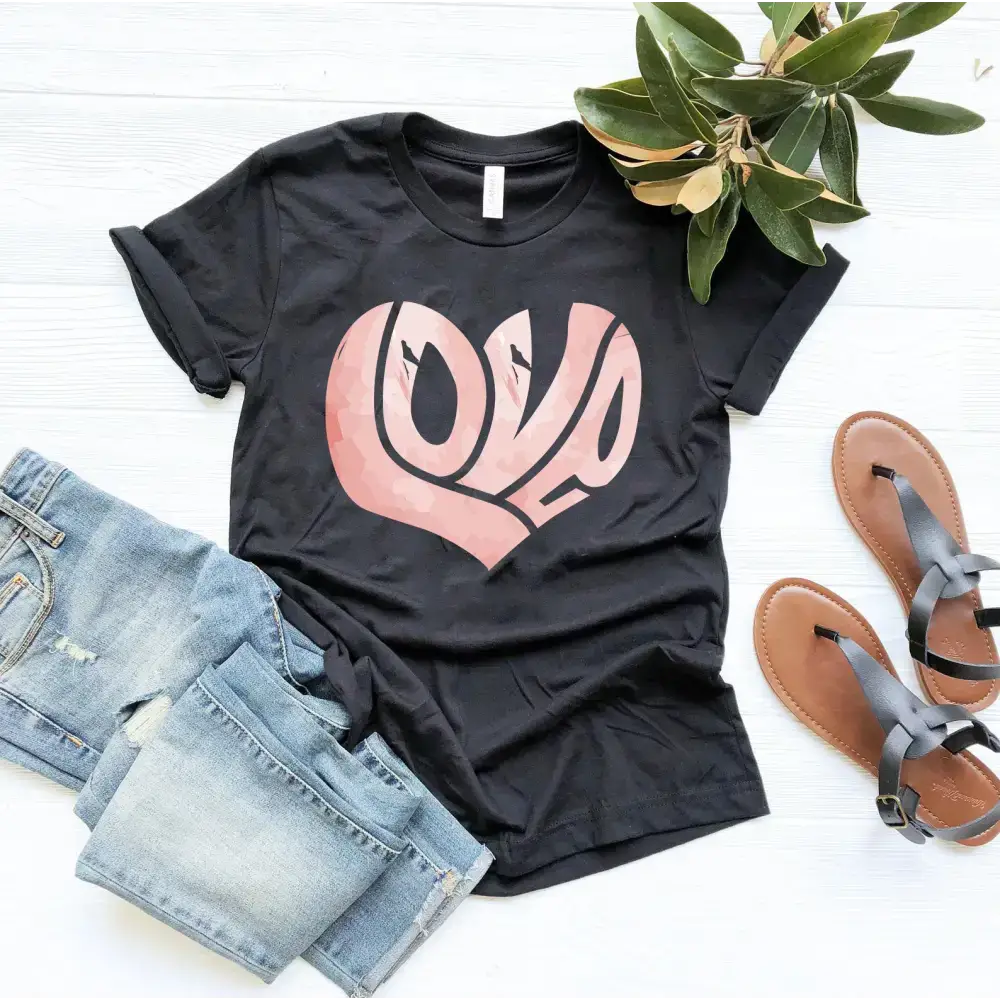 Black Canvas Unisex T-Shirt featuring a pink heart-shaped LOVE design