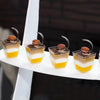 Layered dessert cups with macarons.