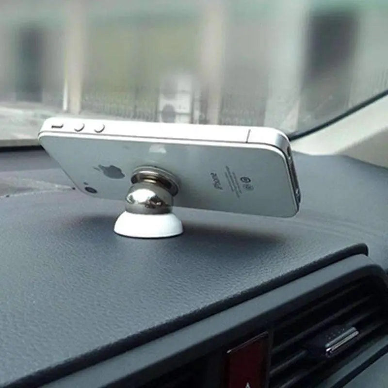 Silver iPhone mounted on Magnetic Phone Holder Mount Dash for easy access in car