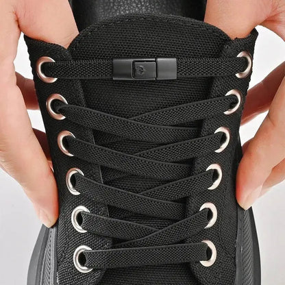 Black canvas shoe featuring innovative press lock shoelaces for easy wear