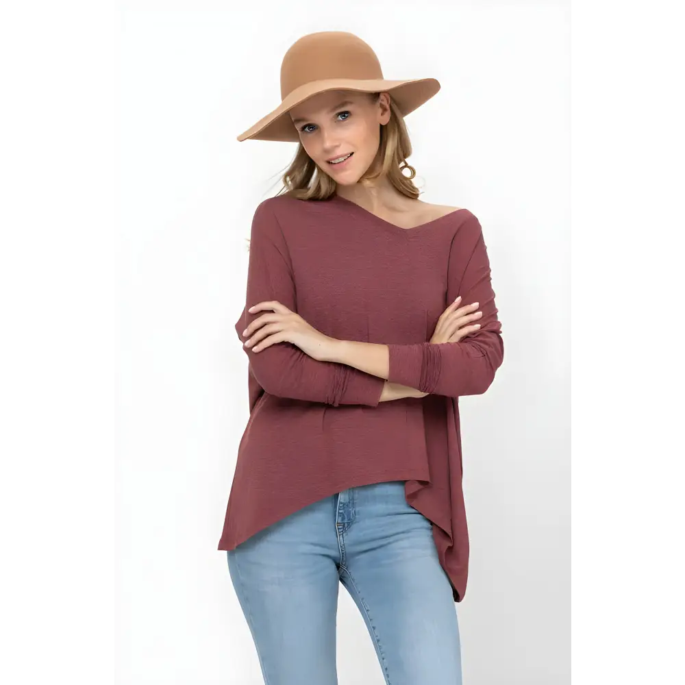 Woman in a brown hat wearing a Mauve Dolman Sleeve Oversized Knit Tunic Blouse