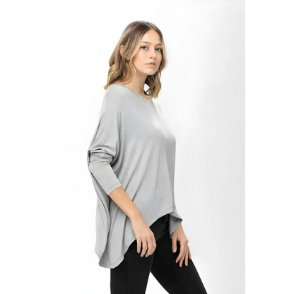 Woman wearing Mauve Dolman Sleeve Oversized Knit Tunic Blouse with gray top and black pants