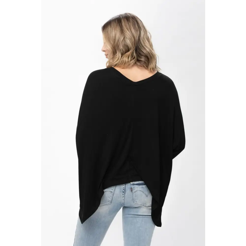 Black V-neck poncho sweater styled with a Mauve Dolman Sleeve Oversized Knit Tunic Blouse