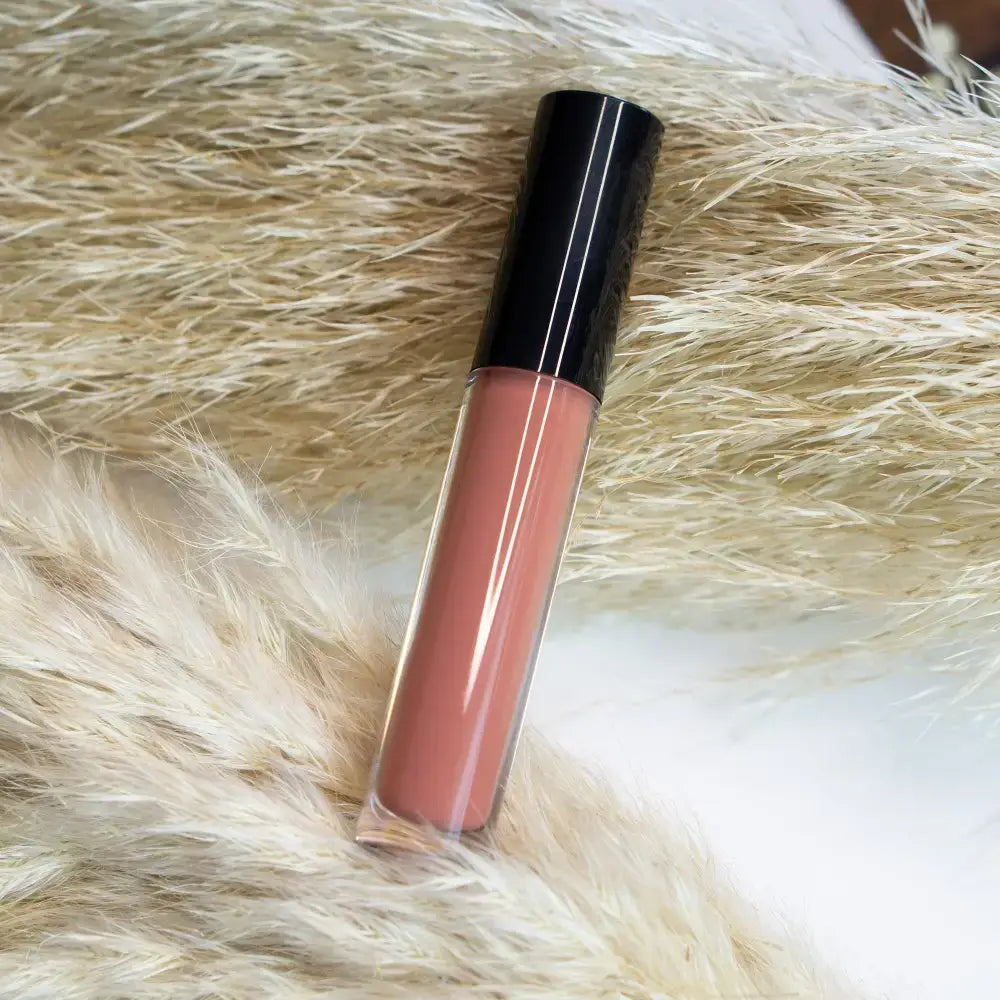 Peach-toned liquid lip gloss with black cap from Mauve Rouge for a natural finish