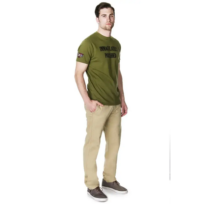 Man in olive t-shirt and khaki pants wearing MCMLXV Men’s Signature Slim Fit Chino