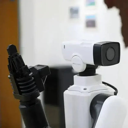 White robot with black gripper on MH3000 customized outdoor surveillance security UGV