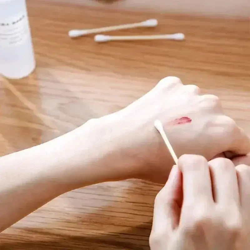 Cotton swab removing red stain, perfect for cleaning with Mighty Cotton Swabs for Baby & Ears