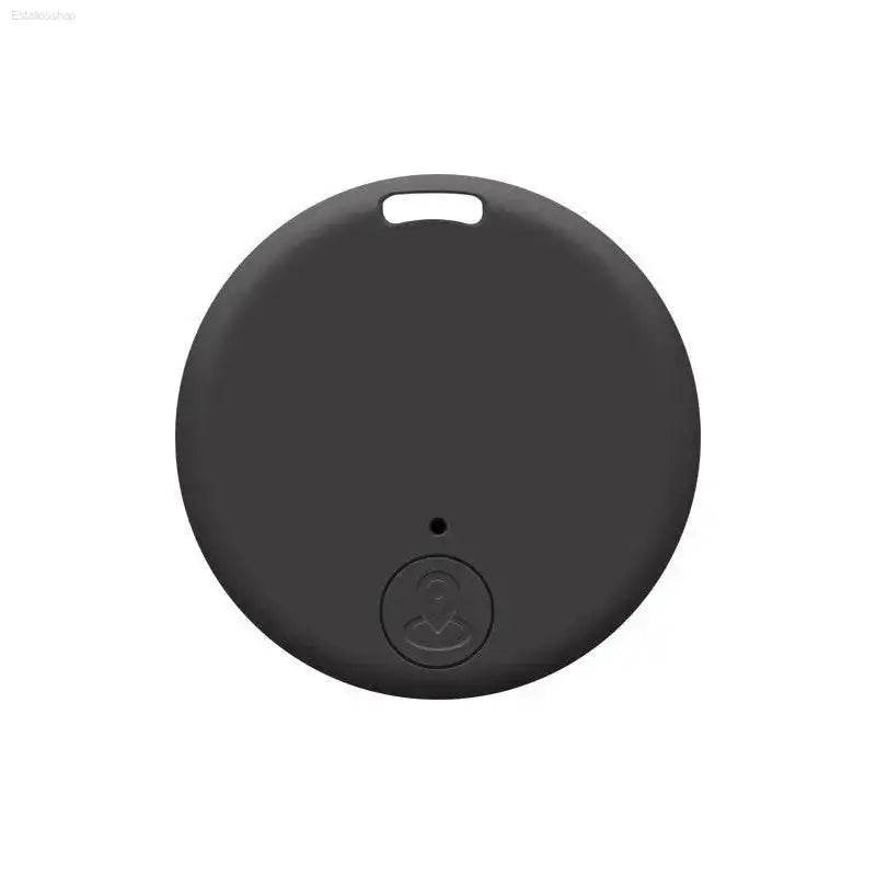 Round, dark gray tracking device.