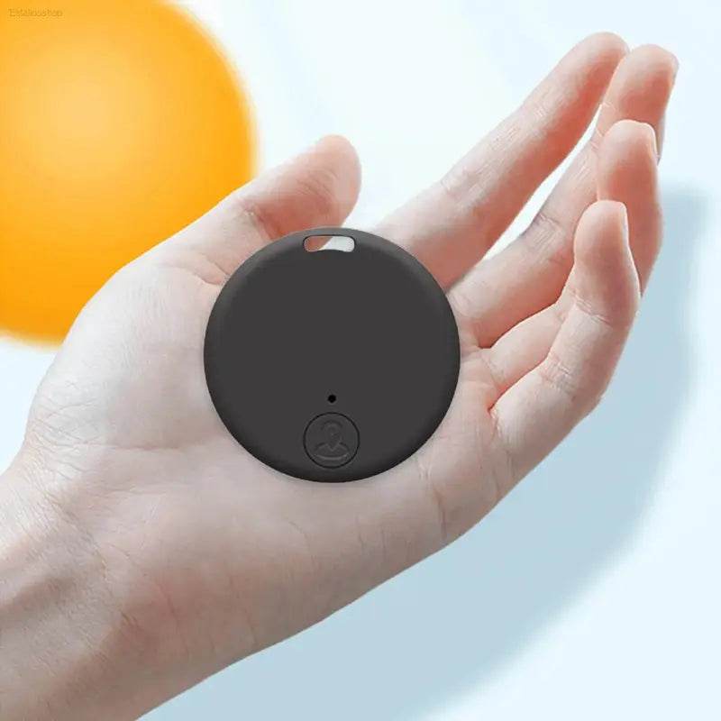 Round, black, electronic tracker.
