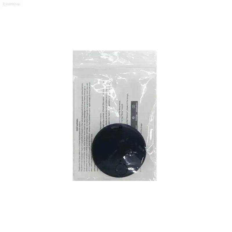 Black circular adhesive pad.
