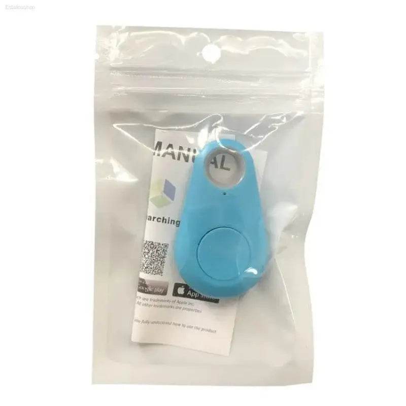 Blue teardrop-shaped tracker in packaging.