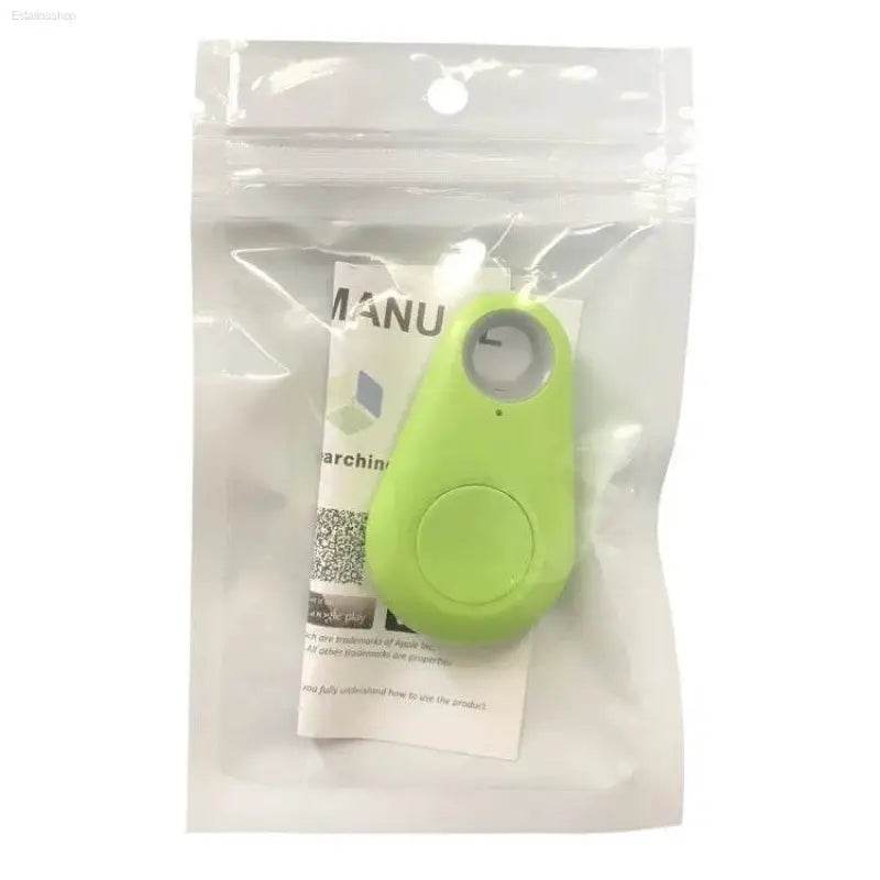 Green, teardrop-shaped tracker in packaging.