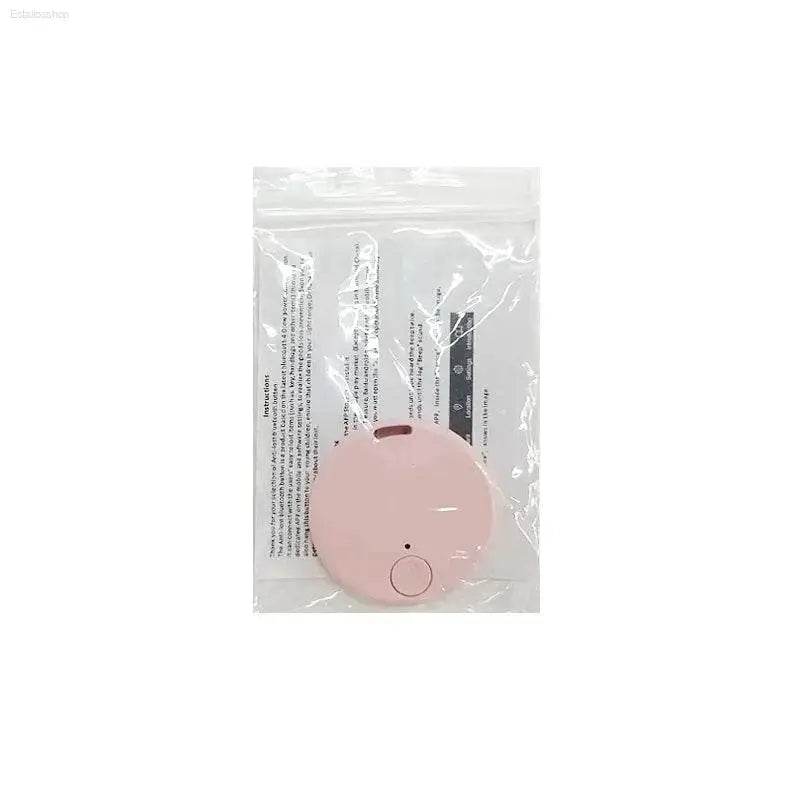 Pink round tracker in packaging.