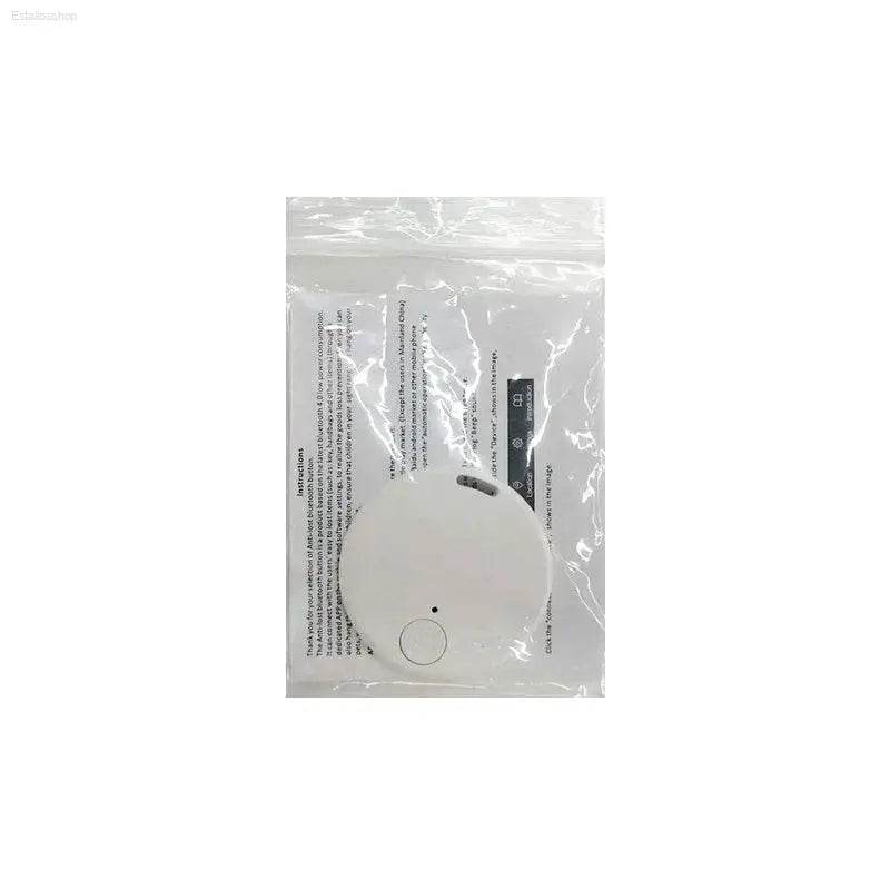 White round tracker in plastic packaging.