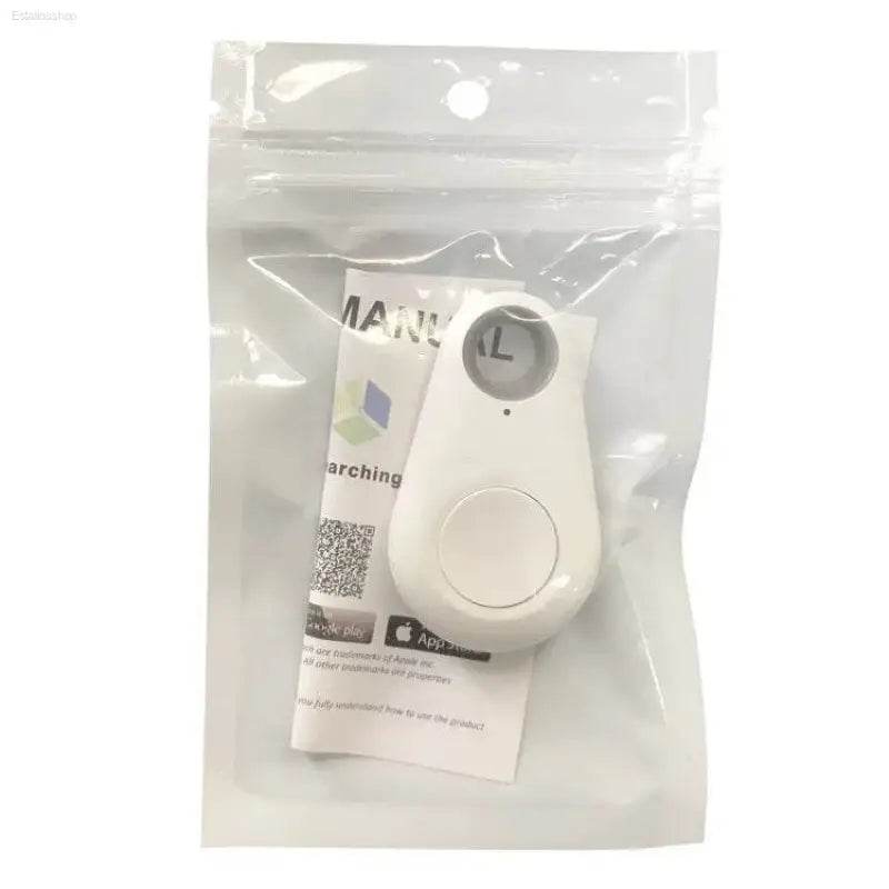 White, teardrop-shaped tracker in a plastic bag.