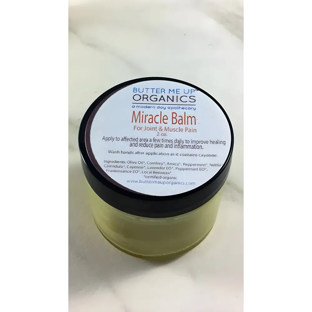 Jar of Miracle Balm Herbal Joint Pain Relief, an organic herbal pain balm for fast relief