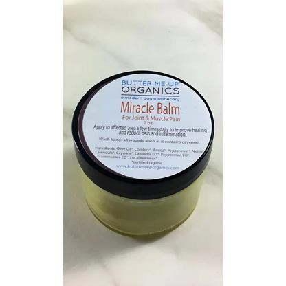 Jar of Miracle Balm Herbal Joint Pain Relief, an organic herbal pain balm for fast relief