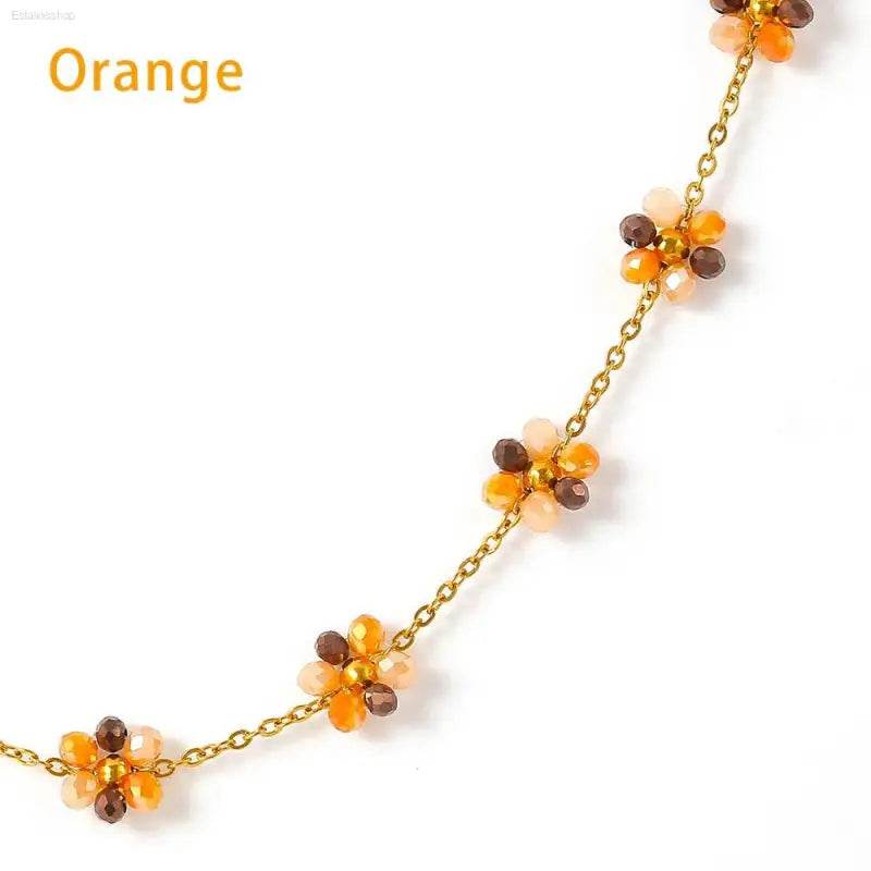 Orange beaded flower necklace.
