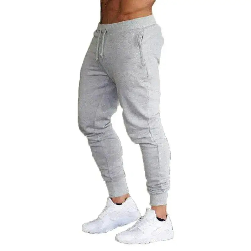 Gray sweatpants and white sneakers perfect for autumn winter men’s casual style