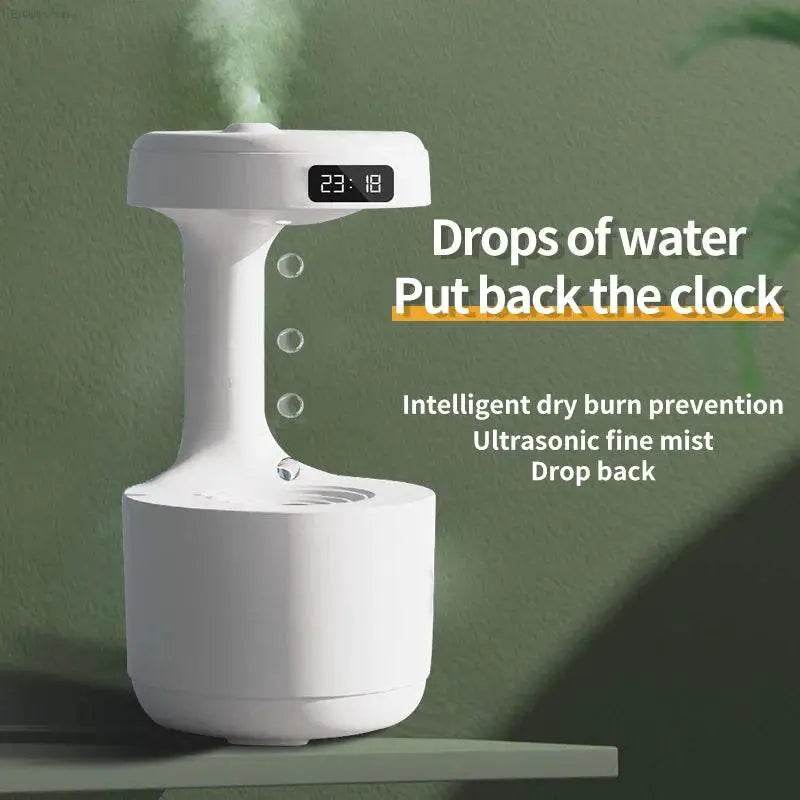 White humidifier with digital clock.