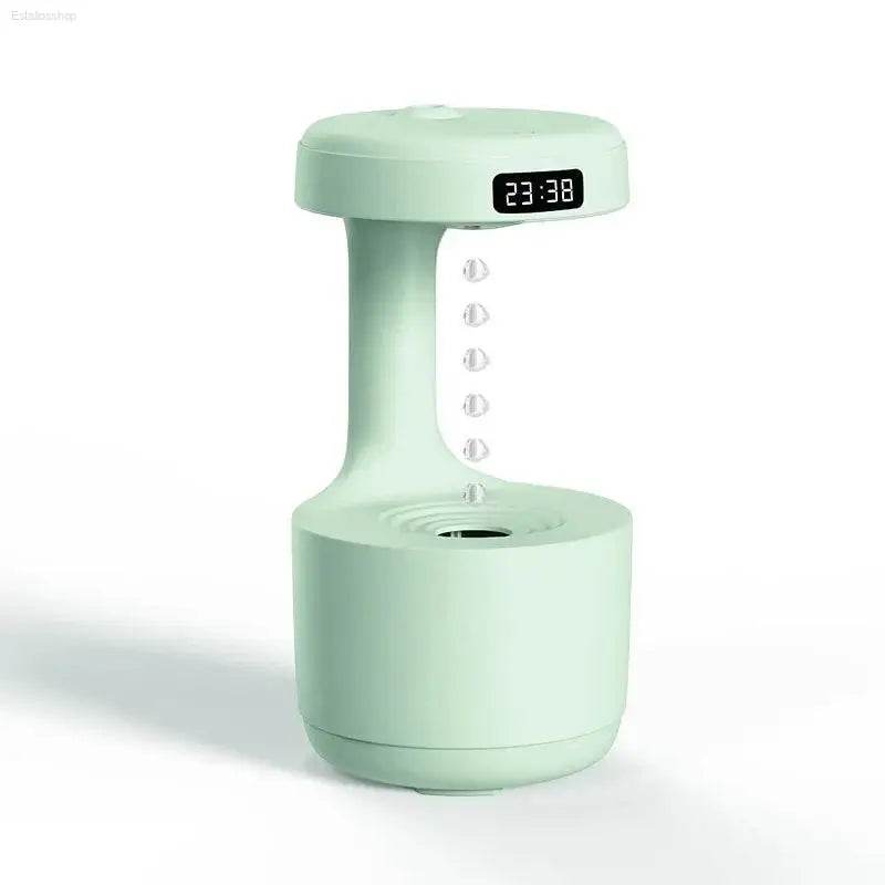 Mint-green anti-gravity humidifier with digital clock.