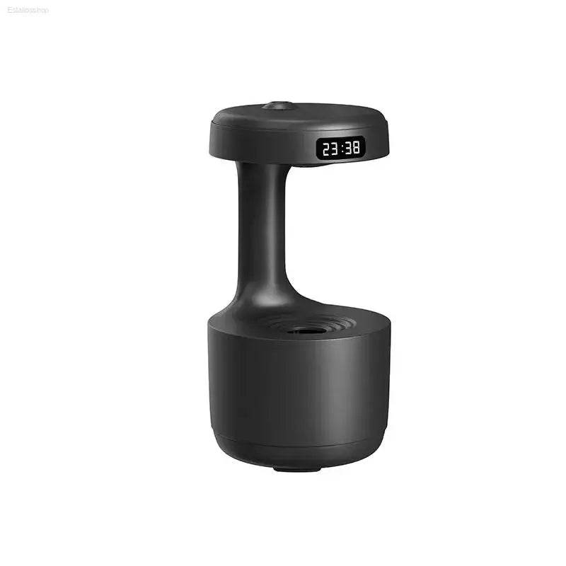 Black, cylindrical humidifier with digital clock.
