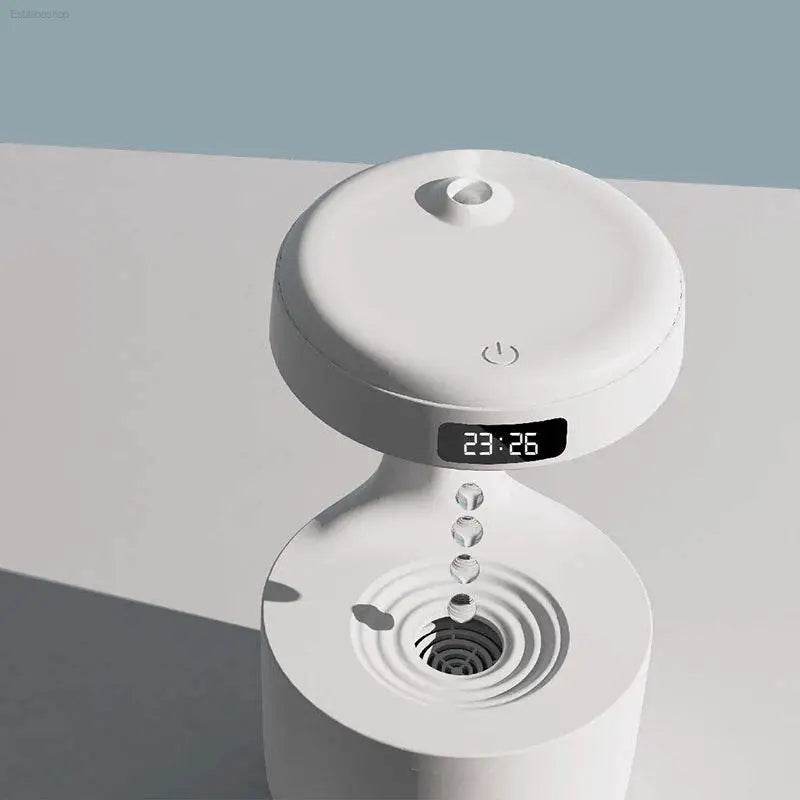 White humidifier with digital clock.