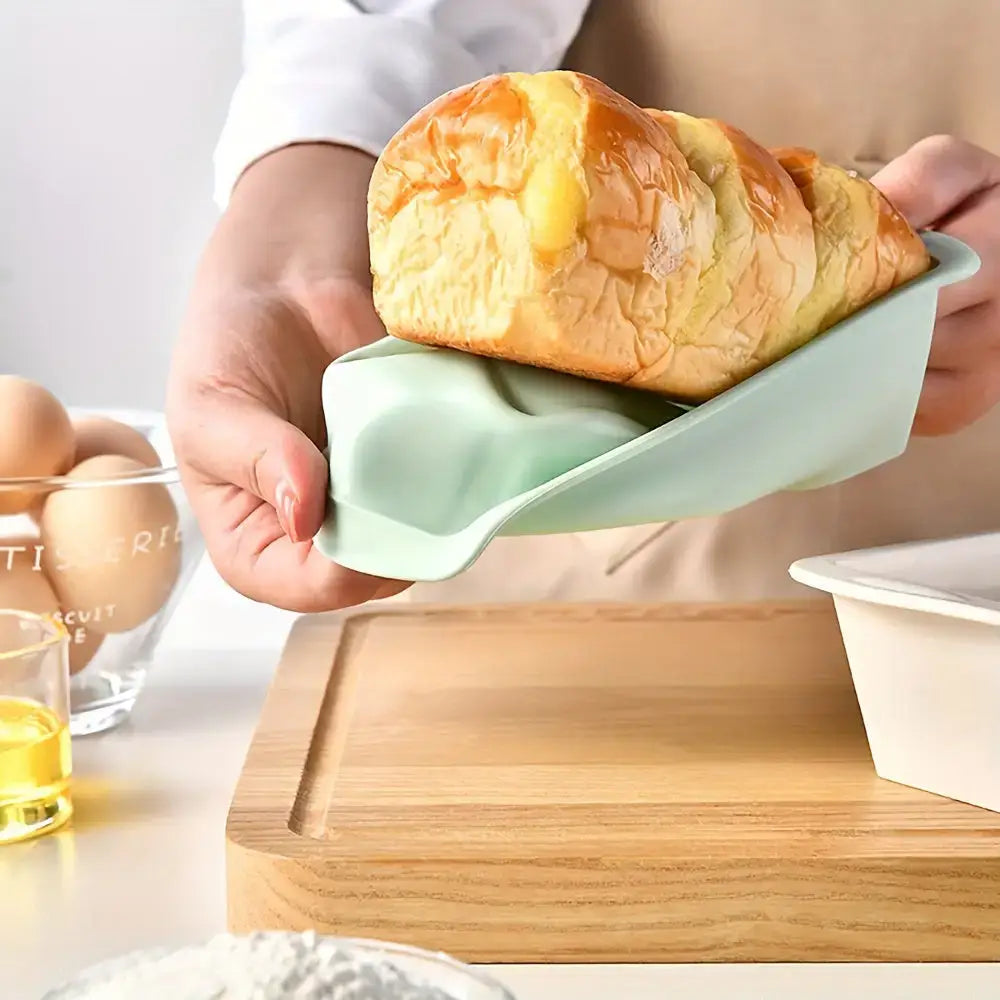 Loaf of bread in a green holder perfect for baking with Nonstick Silicone Loaf Pans