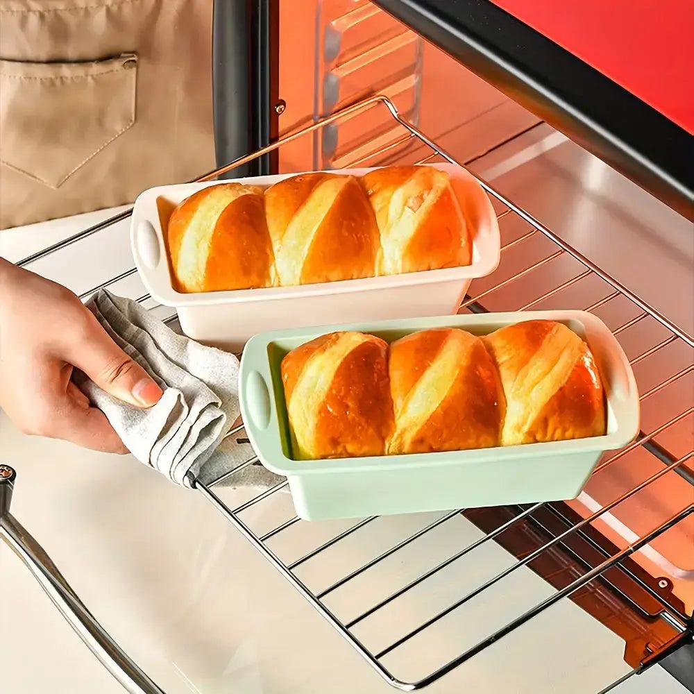 Two loaves of baked bread in nonstick silicone loaf pans for perfect Christmas cookies